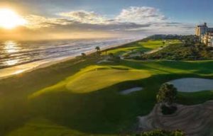 Aerial view of a Hammock Beach Golf Resort and Spa golf hole with beach and Gulf of Mexico in backgound.